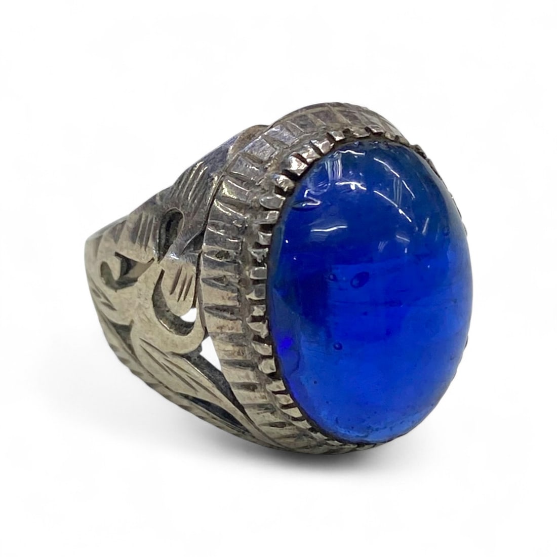 Antique Central Asian Royal Blue Glass Cabochon Silver Ring, c. Early 20th Century, 9g, US 8: Bold, luminous, and unmistakably regal, this antique Central Asian ring showcases a striking deep blue glass cabochon, highly polished and magnified beneath its domed surface. Dating to the early 20th