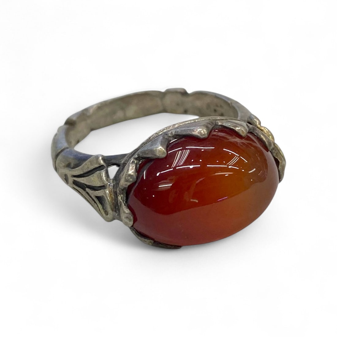 Antique Central Asian Radiant Carnelian Silver Ring, c. Early 20th Century, 10g, US 11: This remarkable Central Asian ring, crafted in silver and crowned with a fiery carnelian cabochon, radiates both symbolic energy and artisanal precision. Dating to the early 20th century, its design r