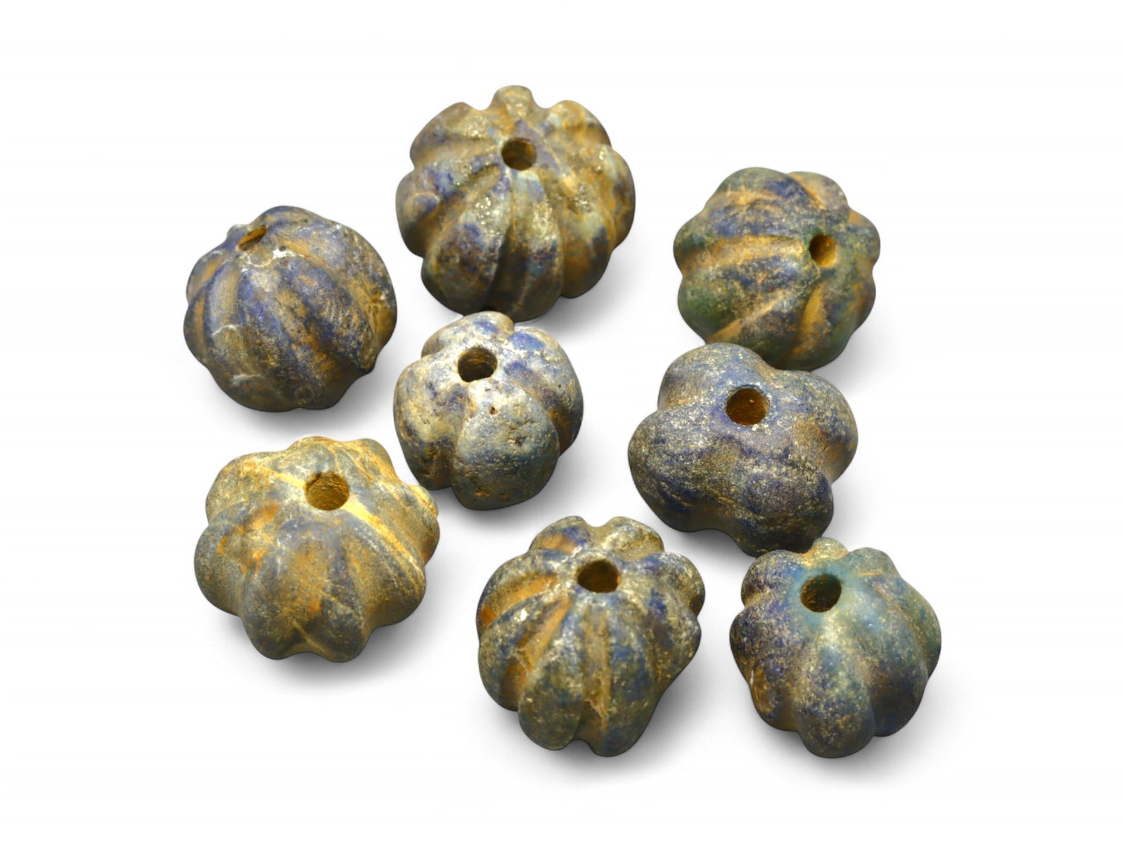 Ancient Egyptian Melon-Shaped Lapis Lazuli Bead Set, c. 18th Dynasty, 29g: This remarkable group of ancient melon-shaped beads, exquisitely carved from lapis lazuli, dates to the Egyptian New Kingdom, likely during the 18th Dynasty (c. 1550-1295 BCE). Their elegant ridged fo