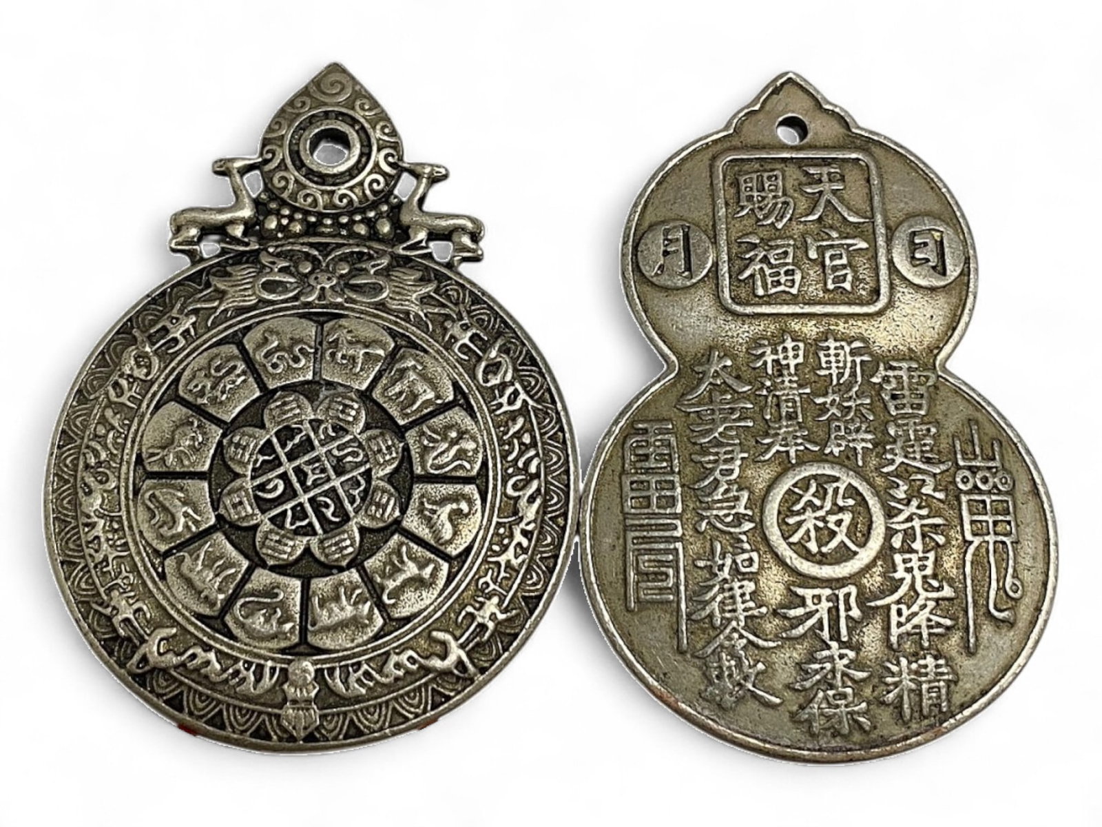 Vintage Chinese Zodiac and Protection Mandala Silver Alloy Medallion Pair, c. Mid-20th Century, 118g: This intricately cast pair of vintage Chinese silver alloy medallions showcases a powerful fusion of Buddhist, Daoist, and zodiacal symbolism. Likely from the mid-20th century, each piece is shaped wi