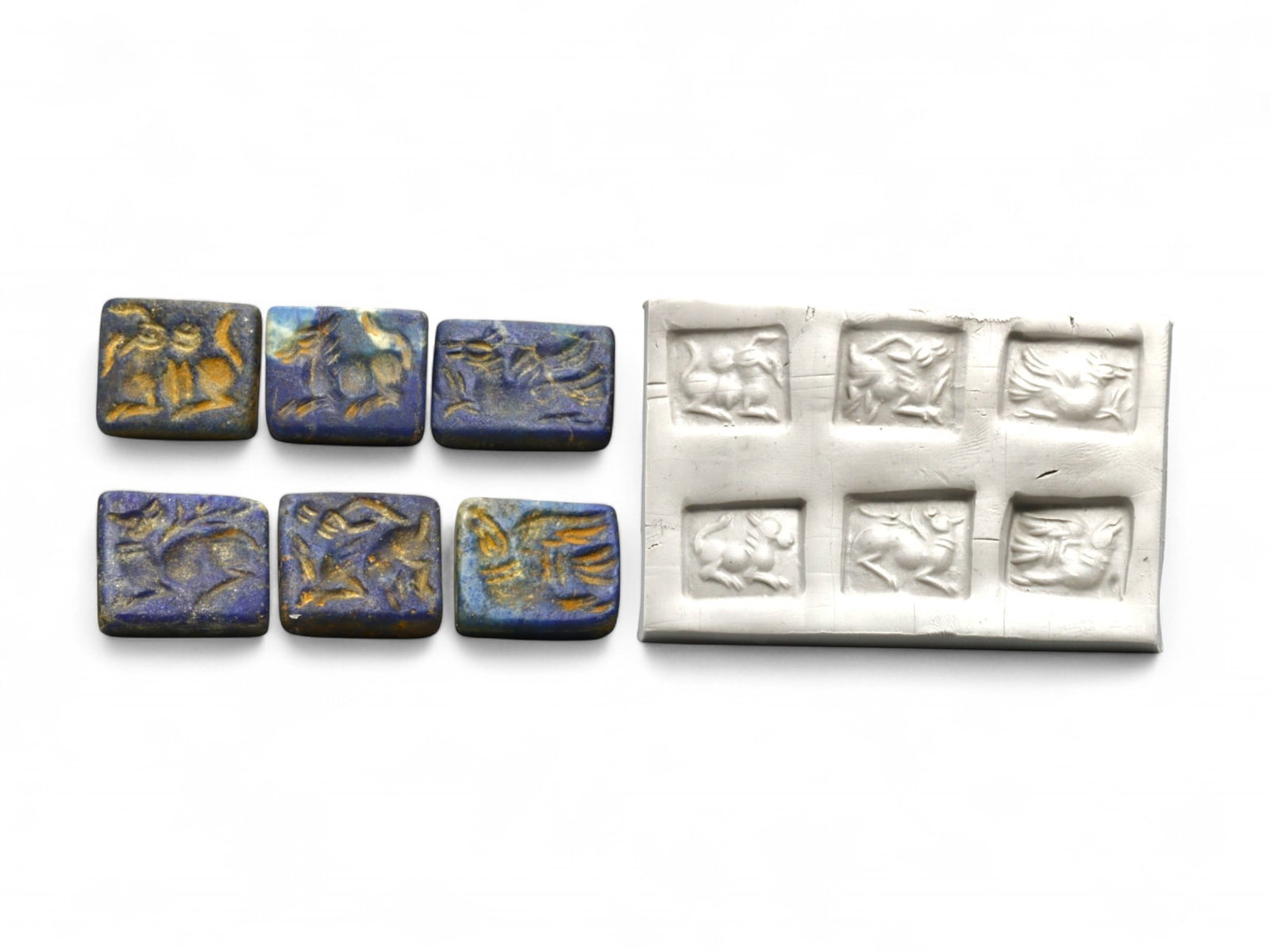 Ancient Elamite Lapis Lazuli Double-Convex Zoomorphic Seals, c. 2500-1800 BCE, 17g: This distinguished group of six double-convex lapis lazuli seals, dating from the Elamite period circa 2500-1800 BCE, showcases the refined miniature artistry and symbolic sophistication of one of the