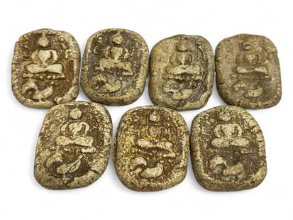 Antique Thai Stacked Buddha Amulet Set in Clay Composite, c. 19th-20th Century CE, 47g: This distinctive set of seven antique Thai amulets, crafted in a warm-toned clay composite, reflects a rare and visually compelling depiction of the Buddha in vertically stacked meditation poses. Like