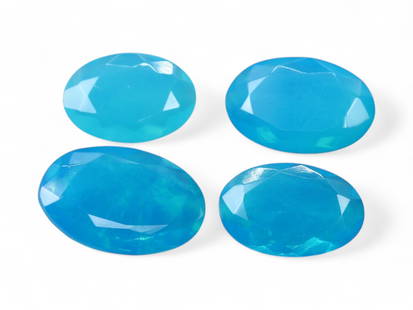 6.15 Carats Aqua Blue Welo Opal Lot - Faceted and Color Enhanced Ethiopian Stones: This luminous set of faceted Welo opals showcases a refreshing aqua-to-teal color palette, achieved through expert enhancement. Their translucent bodies shimmer with subtle hints of mint, seafoam, and