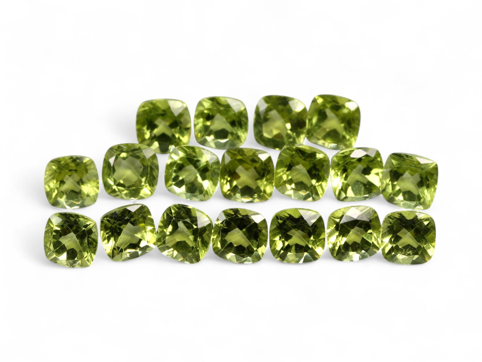 12.38 Carats Bright Green Peridot Parcel - Natural Cushion-Cut Stones: This well-matched parcel of cushion-cut peridot gems dazzles with a crisp, chartreuse-green brilliance. Each stone is precisely faceted to maximize light return, creating a vibrant play of reflections