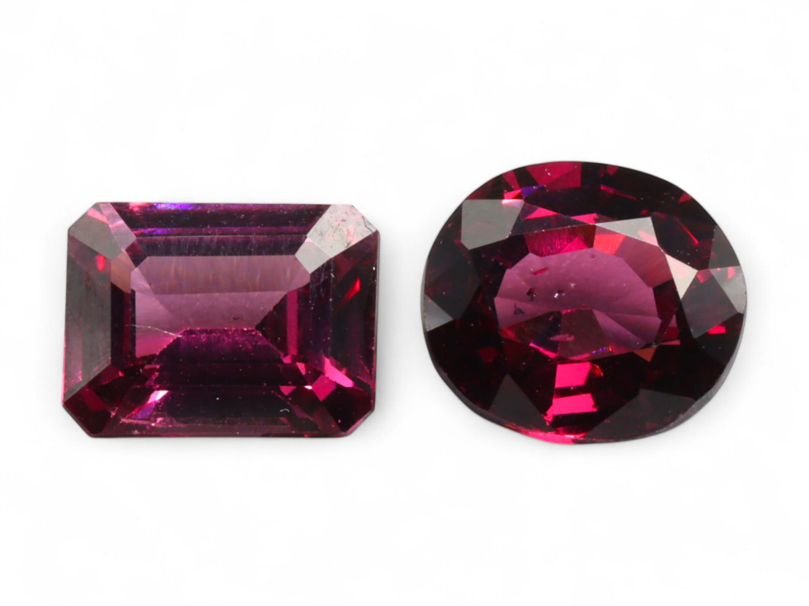 5.06 Carats Mixed-Cut Deep Red Garnet Pair - Natural Mozambique Stones: This richly hued garnet pair offers a striking interplay of geometry and color. One stone is precision-cut in a classic emerald shape, showcasing clean step facets and architectural symmetry, while th
