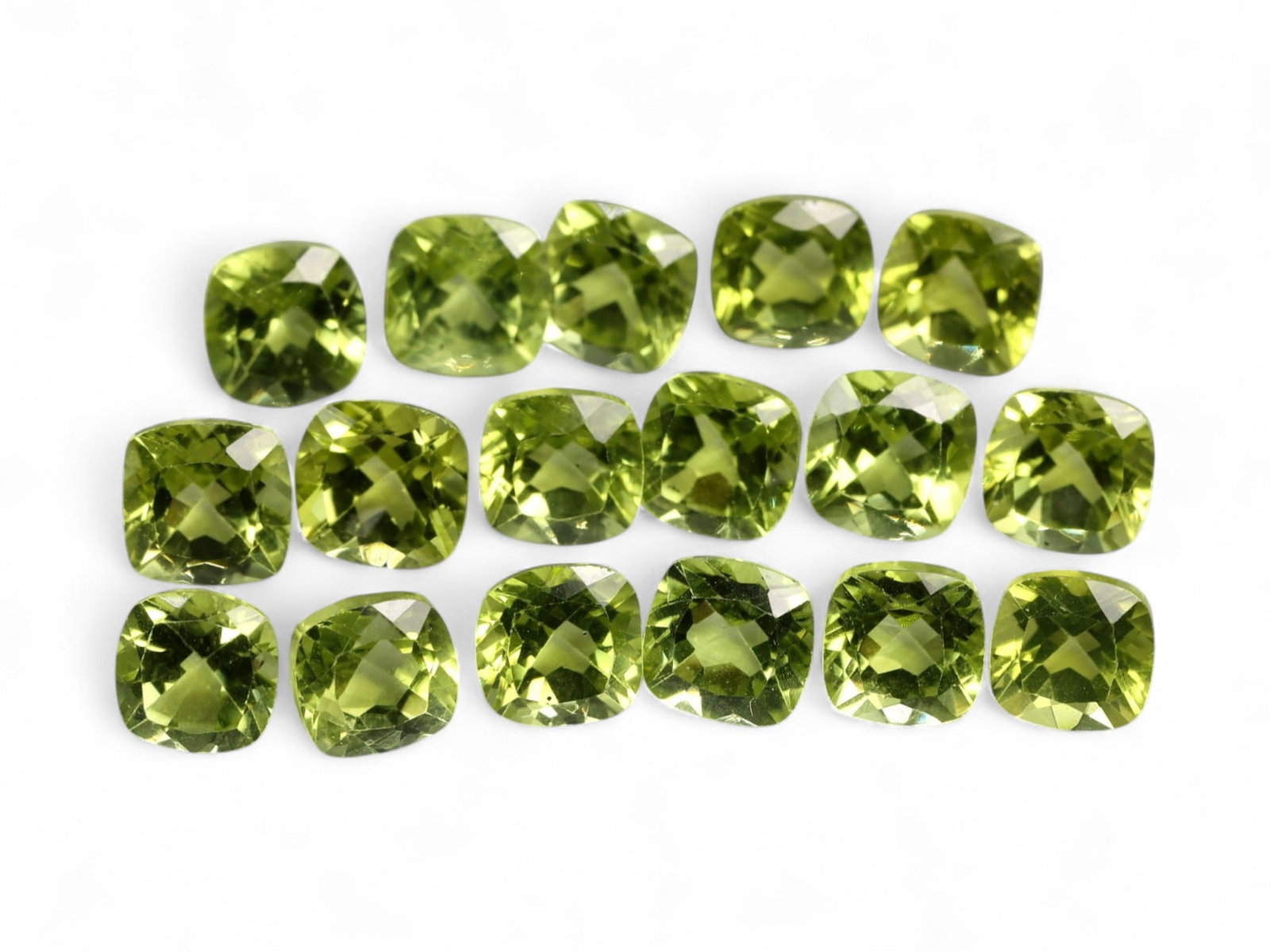 12.58 Carats Bright Green Peridot Parcel - Natural Cushion-Cut Stones: This well-matched parcel of cushion-cut peridot gems dazzles with a crisp, chartreuse-green brilliance. Each stone is precisely faceted to maximize light return, creating a vibrant play of reflections