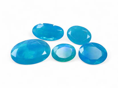 6.79 Carats Aqua Blue Welo Opal Lot - Faceted and Color Enhanced Ethiopian Stones: This luminous set of faceted Welo opals showcases a refreshing aqua-to-teal color palette, achieved through expert enhancement. Their translucent bodies shimmer with subtle hints of mint, seafoam, and