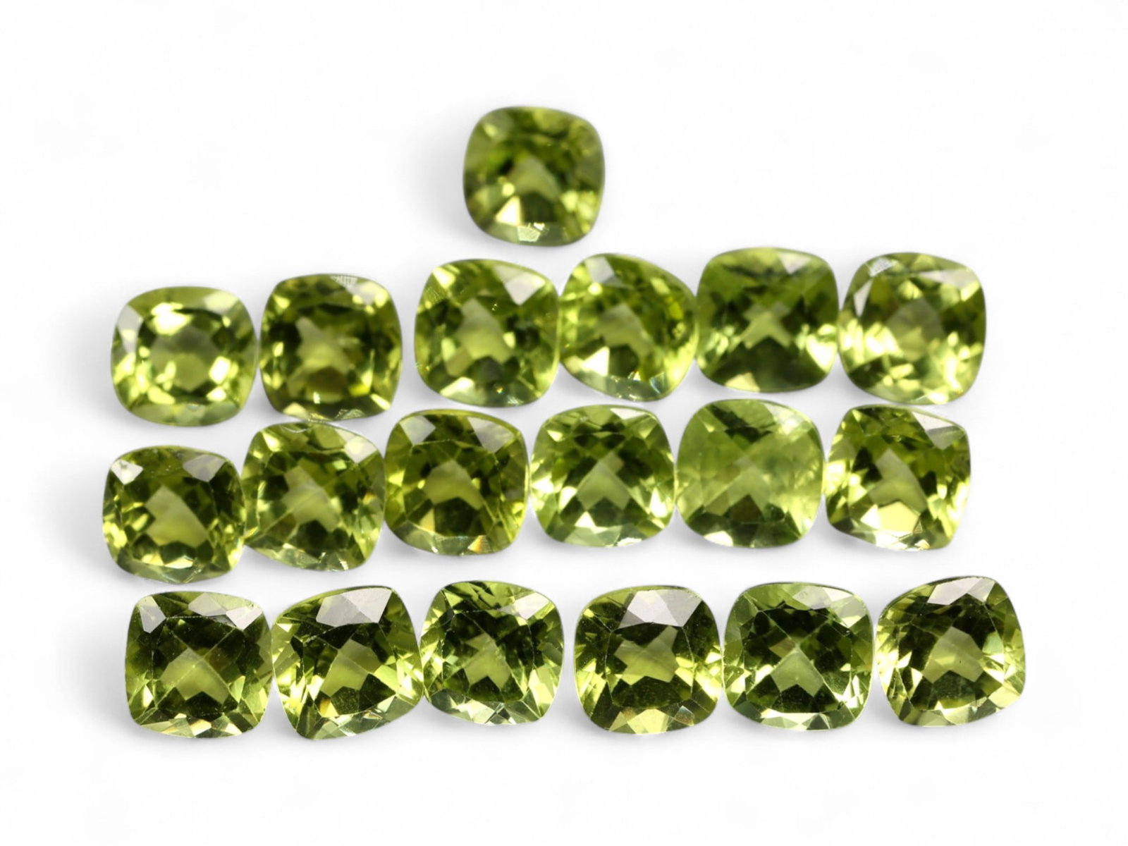 12.25 Carats Bright Green Peridot Parcel - Natural Cushion-Cut Stones: This well-matched parcel of cushion-cut peridot gems dazzles with a crisp, chartreuse-green brilliance. Each stone is precisely faceted to maximize light return, creating a vibrant play of reflections