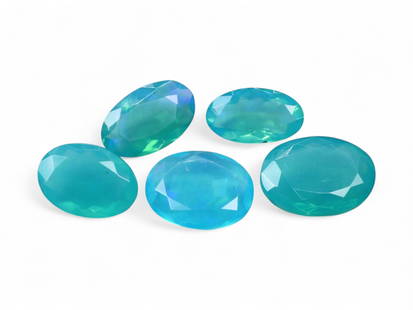 7.51 Carats Aqua Blue Welo Opal Lot - Faceted and Color Enhanced Ethiopian Stones: This luminous set of faceted Welo opals showcases a refreshing aqua-to-teal color palette, achieved through expert enhancement. Their translucent bodies shimmer with subtle hints of mint, seafoam, and