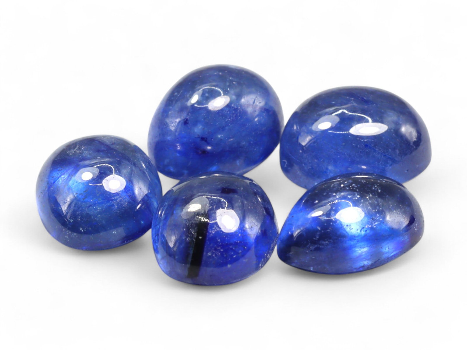 17.69 Carats Royal Blue Sapphire Cabochon Parcel - Natural Sri Lankan Stones: This luminous parcel of royal blue sapphire cabochons showcases a smooth, polished glow that highlights the depth and saturation of each gem. The domed surfaces reveal gentle light play and a silky tr