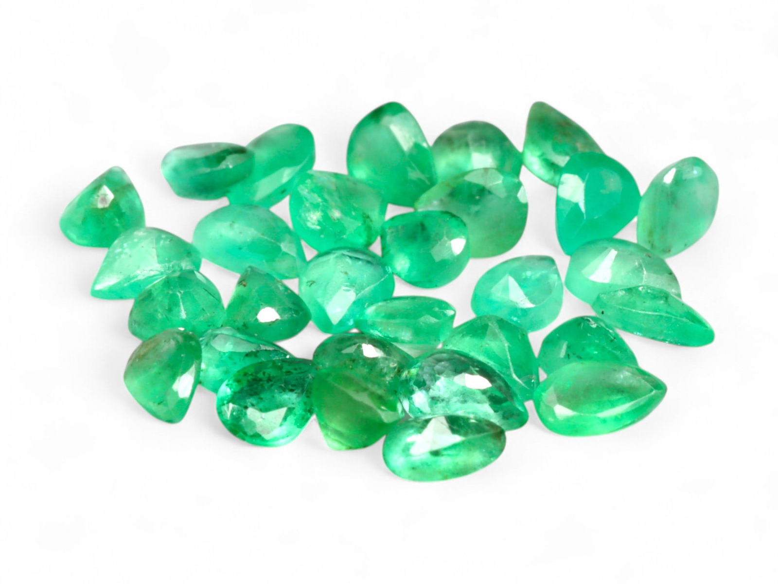 3.30 Carats Vivid Green Emerald Pear Lot - Natural Colombian Stones: This lot of pear-shaped emeralds shines with the lush, garden-green glow for which Colombian stones are celebrated. Each gem captures a slightly varied tone within the vivid green spectrum, enhanced b
