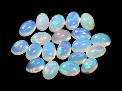 7.89 Carats Multicolor Welo Opal Cabochon Lot - Natural Ethiopian Stones: This lively lot of Welo opal cabochons radiates with a kaleidoscopic play-of-color, showcasing flashes of neon green, fiery red, golden yellow, and electric blue beneath their smooth, translucent dome