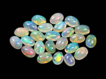 7.18 Carats Multicolor Welo Opal Cabochon Lot - Natural Ethiopian Stones: This lively lot of Welo opal cabochons radiates with a kaleidoscopic play-of-color, showcasing flashes of neon green, fiery red, golden yellow, and electric blue beneath their smooth, translucent dome