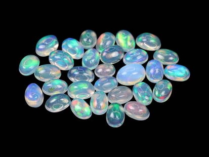 9.65 Carats Multicolor Welo Opal Cabochon Lot - Natural Ethiopian Stones: This lively lot of Welo opal cabochons radiates with a kaleidoscopic play-of-color, showcasing flashes of neon green, fiery red, golden yellow, and electric blue beneath their smooth, translucent dome