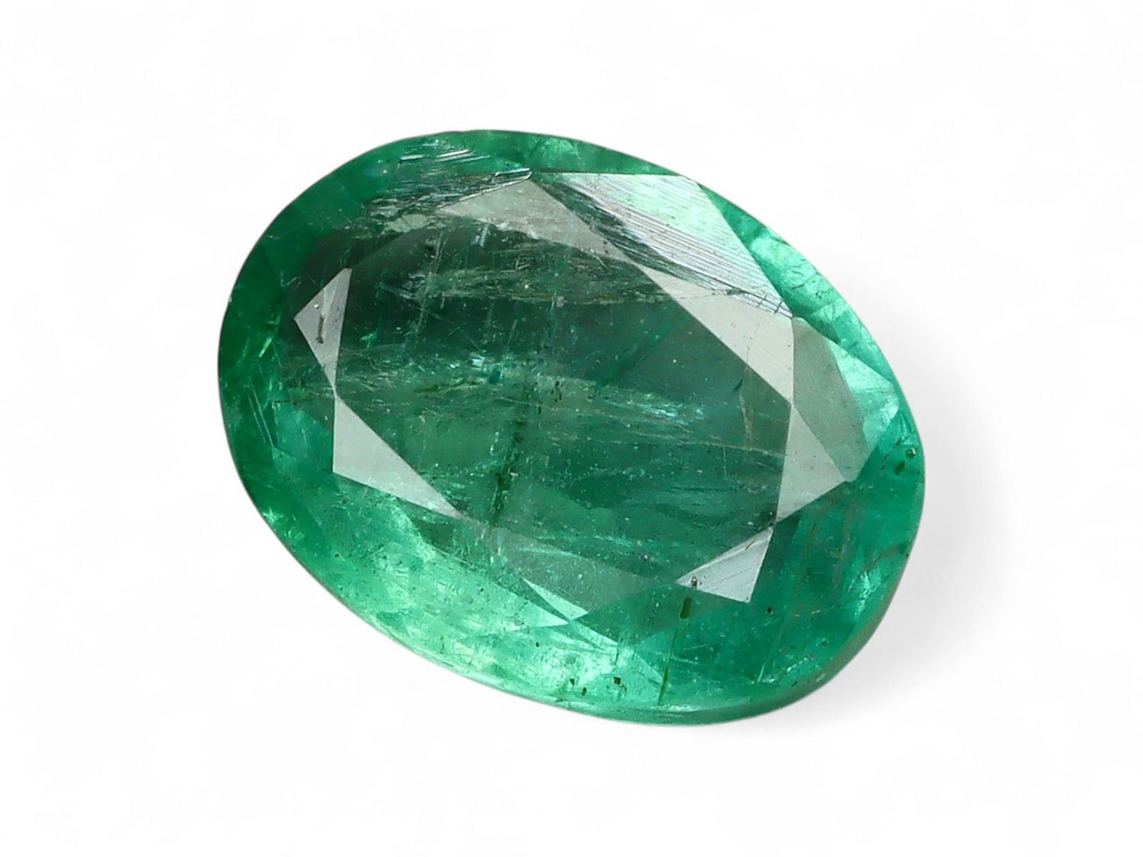 1.14 Carats Vivid Green Emerald Oval - Natural Zambian Stone: This oval-cut emerald captivates with a deep, vibrant green hue, a defining characteristic of Zambia's finest gemstone production. Its symmetrical oval form offers a timeless silhouette, while the wel