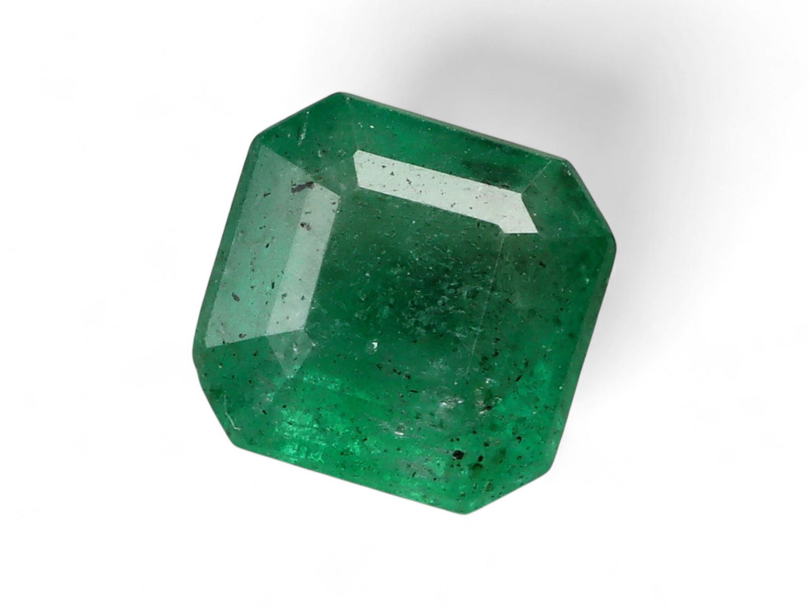 0.93 Carats Vivid Green Emerald - Natural Zambian Stone: This striking emerald displays a lively and saturated green, characteristic of Zambia's most coveted production. The stone's vivid hue is complemented by a fine balance of transparency and natural inc