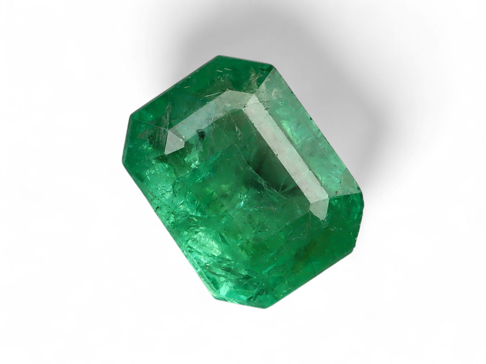 1.32 Carats Vivid Green Emerald - Natural Zambian Stone: This striking emerald displays a lively and saturated green, characteristic of Zambia's most coveted production. The stone's vivid hue is complemented by a fine balance of transparency and natural inc