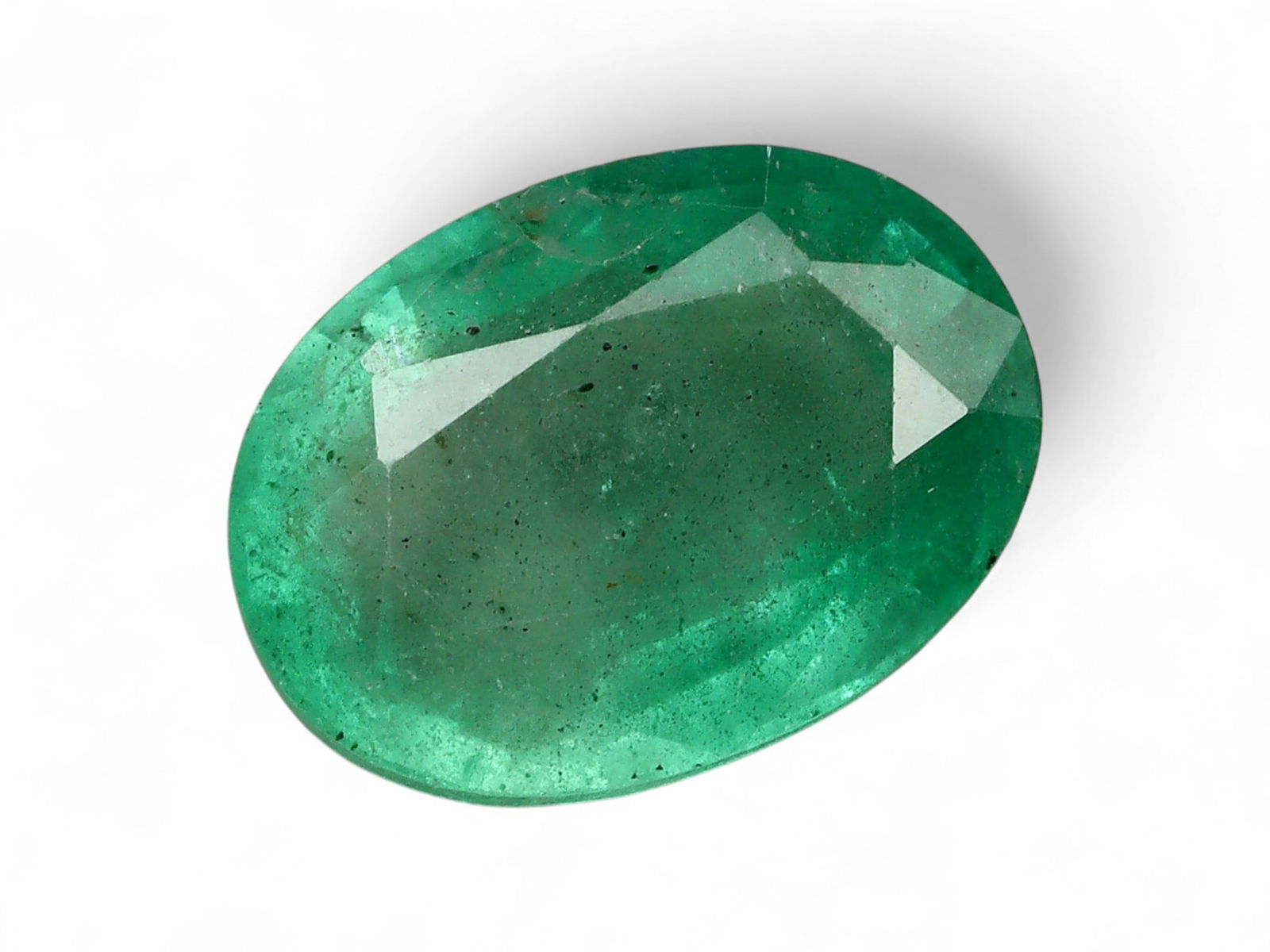1.64 Carats Vivid Green Emerald Oval - Natural Zambian Stone: This oval-cut emerald captivates with a deep, vibrant green hue, a defining characteristic of Zambia's finest gemstone production. Its symmetrical oval form offers a timeless silhouette, while the wel