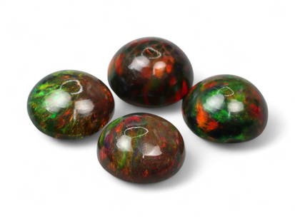 4.20 Carats Black Smoked Welo Opal Cabochon Lot - Natural Ethiopian Stones: This captivating lot of four black smoked Welo opals bursts with vibrant play-of-color, featuring flashes of emerald green, intense crimson, golden orange, and subtle violet across their domed cabocho