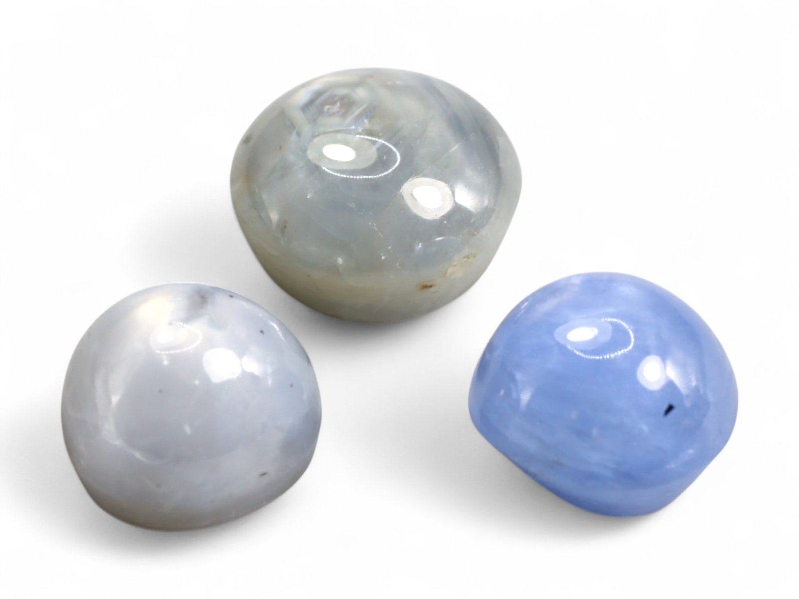 8.52 Carats Blue and Gray Star Sapphire Trio - Natural Burmese Stones: This attractive trio of Burmese star sapphires displays a serene mix of soft blue and silvery-gray body colors, each with the potential to reveal the star-like asterism that makes this variety so capt
