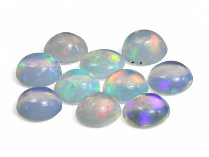 7.30 Carats Play-of-Color Welo Opal Cabochon Lot - Natural Ethiopian Stones: This captivating lot of Welo opal cabochons glows with ethereal beauty, showcasing a translucent base infused with vibrant flashes of green, red, orange, blue, and violet. Each cabochon reveals its ow