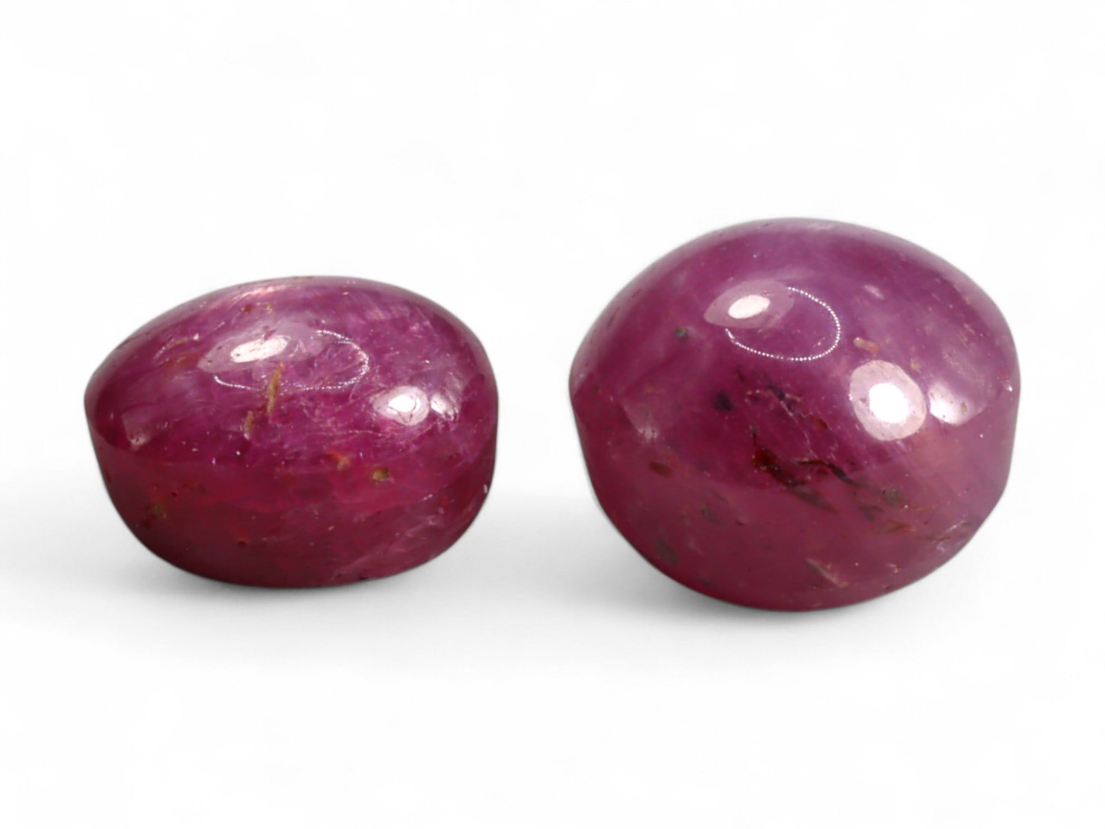 6.60 Carats Deep Pinkish-Red Star Ruby Duo - Natural Burmese Stones: This Burmese star ruby duo showcases a rich pinkish-red body color with the potential for the six-rayed star phenomenon that makes this gem variety so enchanting. Smooth cabochon polishing enhances th