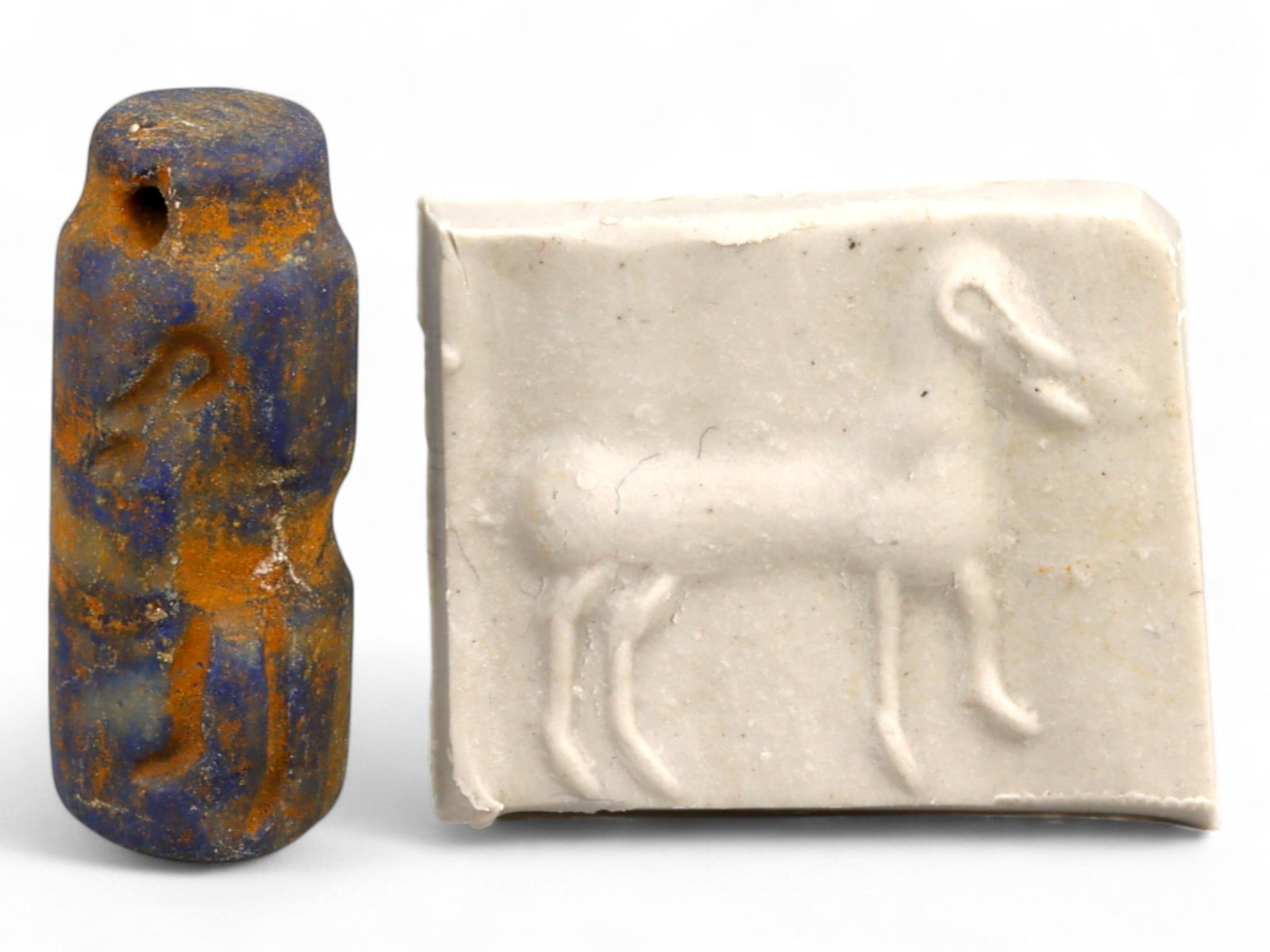 Ancient Elamite Stylized Ibex Motif Lapis Lazuli Cylinder Seal, c. 2500-1800 BCE, 4.5g: This ancient lapis lazuli cylinder seal, dating to the Elamite period between 2500 and 1800 BCE, exemplifies the minimalist yet powerful symbolism characteristic of early Bronze Age southwestern Iran.
