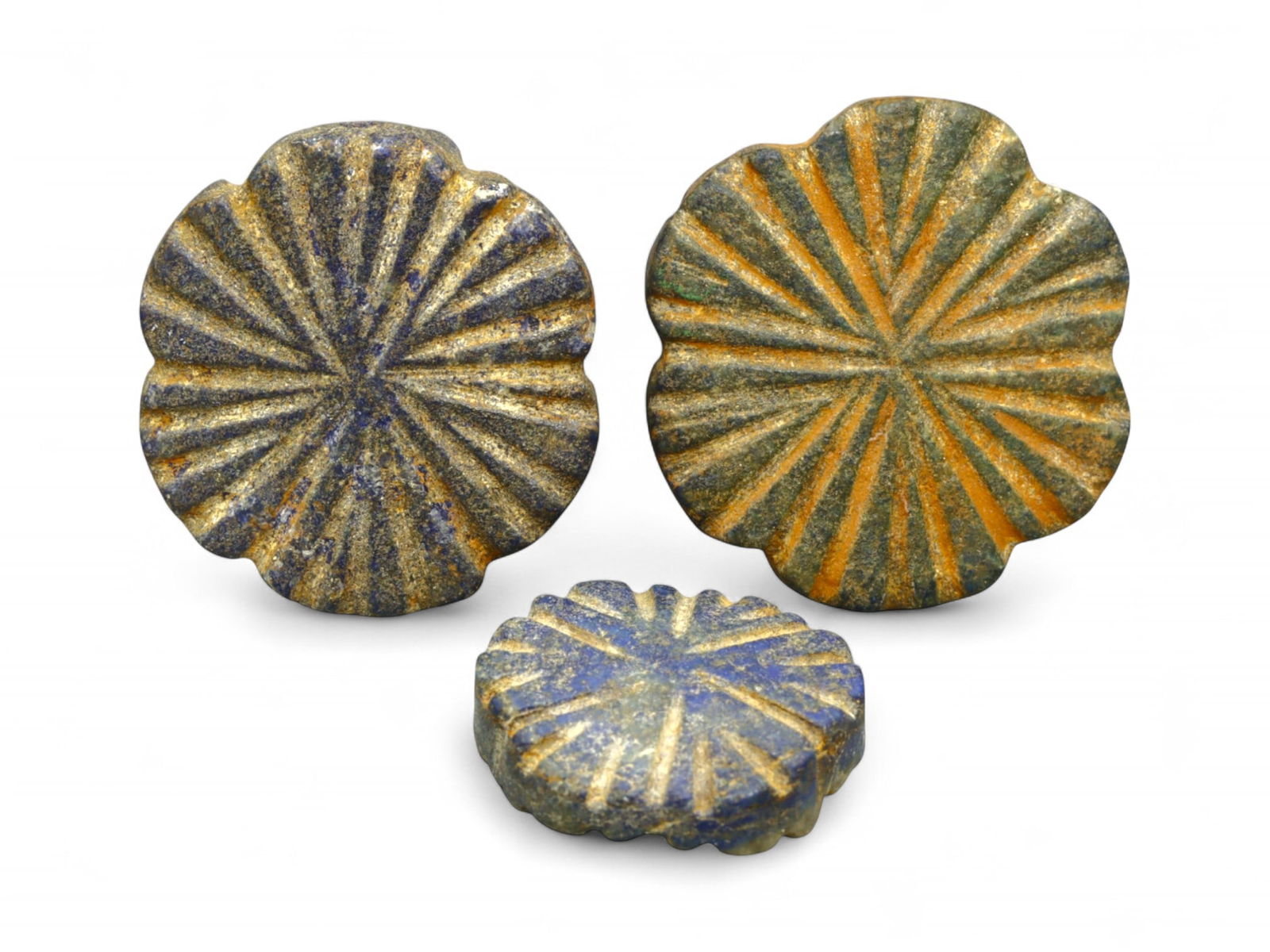 Ancient Elamite Radiant Rosette Lapis Lazuli Amulet Trio, c. 2500-1800 BCE, 30g: This radiant trio of ancient rosette-shaped lapis lazuli amulets, carved in the form of sunburst floral medallions, dates to the Elamite civilization of southwestern Iran, circa 2500-1800 BCE. Measuri