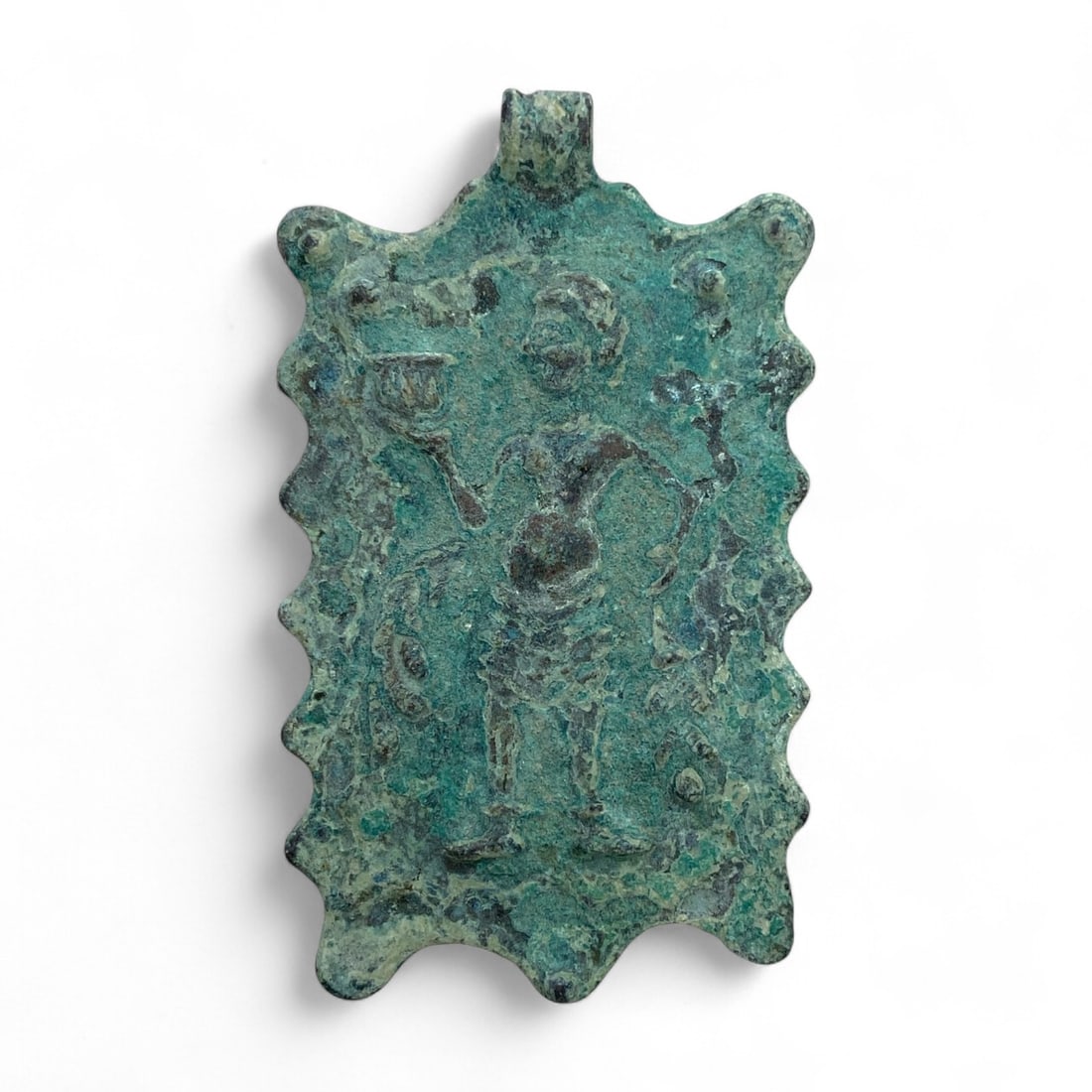 Ancient Roman Bronze Pendant Plaque with Bacchic Figure, c. 2nd-4th Century CE, 52g: This finely cast bronze pendant plaque, dating to the 2nd-4th century CE, depicts a standing Bacchic figure, likely inspired by the imagery of Dionysus/Bacchus or one of his attendants. Holding a wine