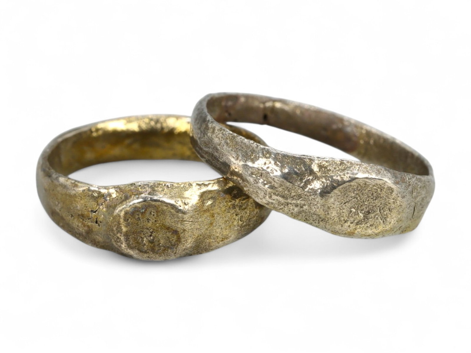 Ancient Roman Pair of Engraved Bezel Bronze Rings with Gilding, 2nd-4th Century CE, US 3 & 4.5, 2.5g: This matched pair of Ancient Roman bronze rings, dating to the 2nd-4th century CE, reflects the Empire's enduring preference for simple yet meaningful personal adornments. Each ring features a small, 