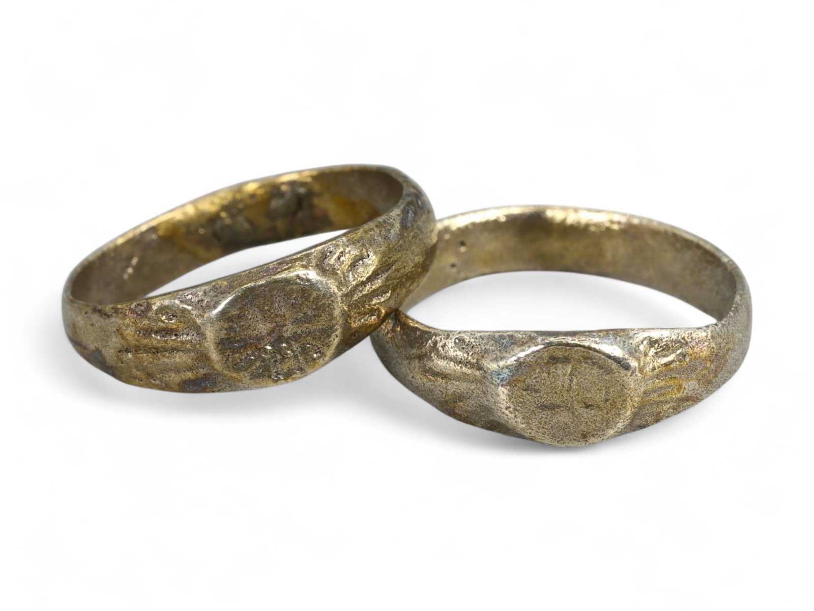 Ancient Roman Pair of Radiating Sunburst Bronze Rings, c. 2nd-4th Century CE, US 3.5 & 3.75, 3.14g: This matched pair of Ancient Roman bronze rings, dating to the 2nd-4th century CE, features circular bezels engraved with radiating sunburst motifs - a design symbolizing divine light, protection, and