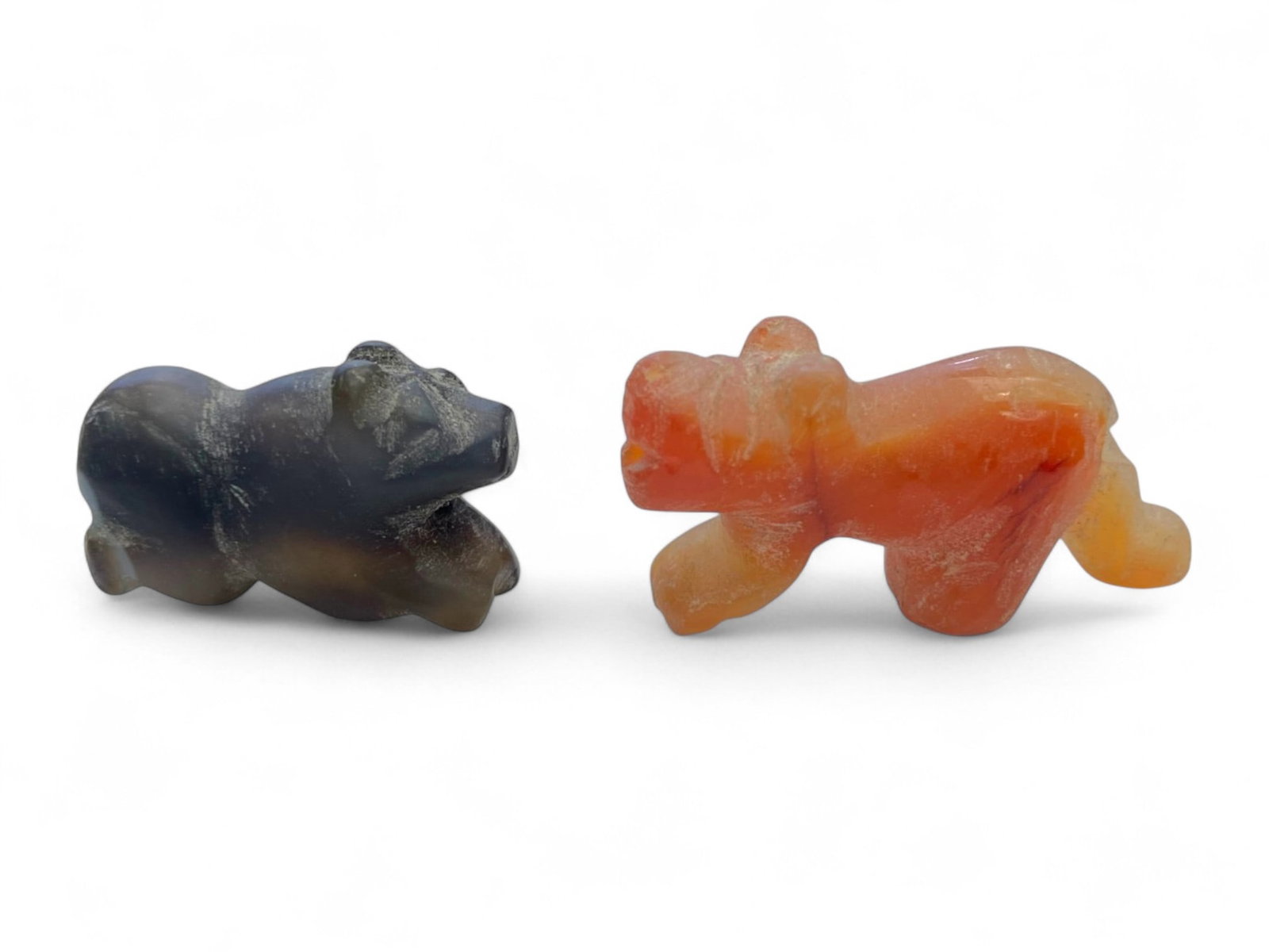 Ancient Near Eastern Zoomorphic Agate and Carnelian Amulet Pair, c. 3rd-1st Millennium BCE, 10g: This compelling pair of zoomorphic amulets-one carved from dark agate and the other from vibrant carnelian-exemplifies the spiritual symbolism and refined lapidary tradition of the ancient Near East a