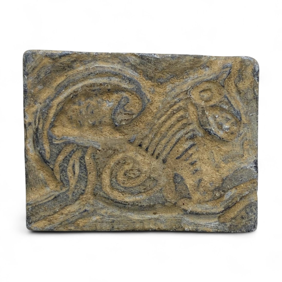 Ancient Near Eastern Horse Motif Zoomorphic Relief Plaque in Sandstone, c. 1st Millennium BCE, 45g: This evocative carved sandstone plaque, weighing 45 grams (1.6 ounces) and measuring approximately 4 x 5 cm (1.6 x 2 inches), features an abstract depiction of a horse or similar hoofed animal in flow
