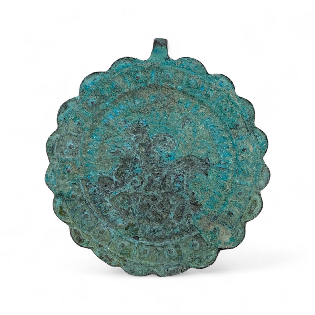 Ancient Byzantine Equestrian Warrior Bronze Amulet Pendant, c. 9th-12th Century CE, 76g: This powerful bronze amulet pendant from the Byzantine era, dating approximately to the 9th-12th century CE, embodies the empire's deeply spiritual and militaristic symbolism. Cast in a broad, scallop