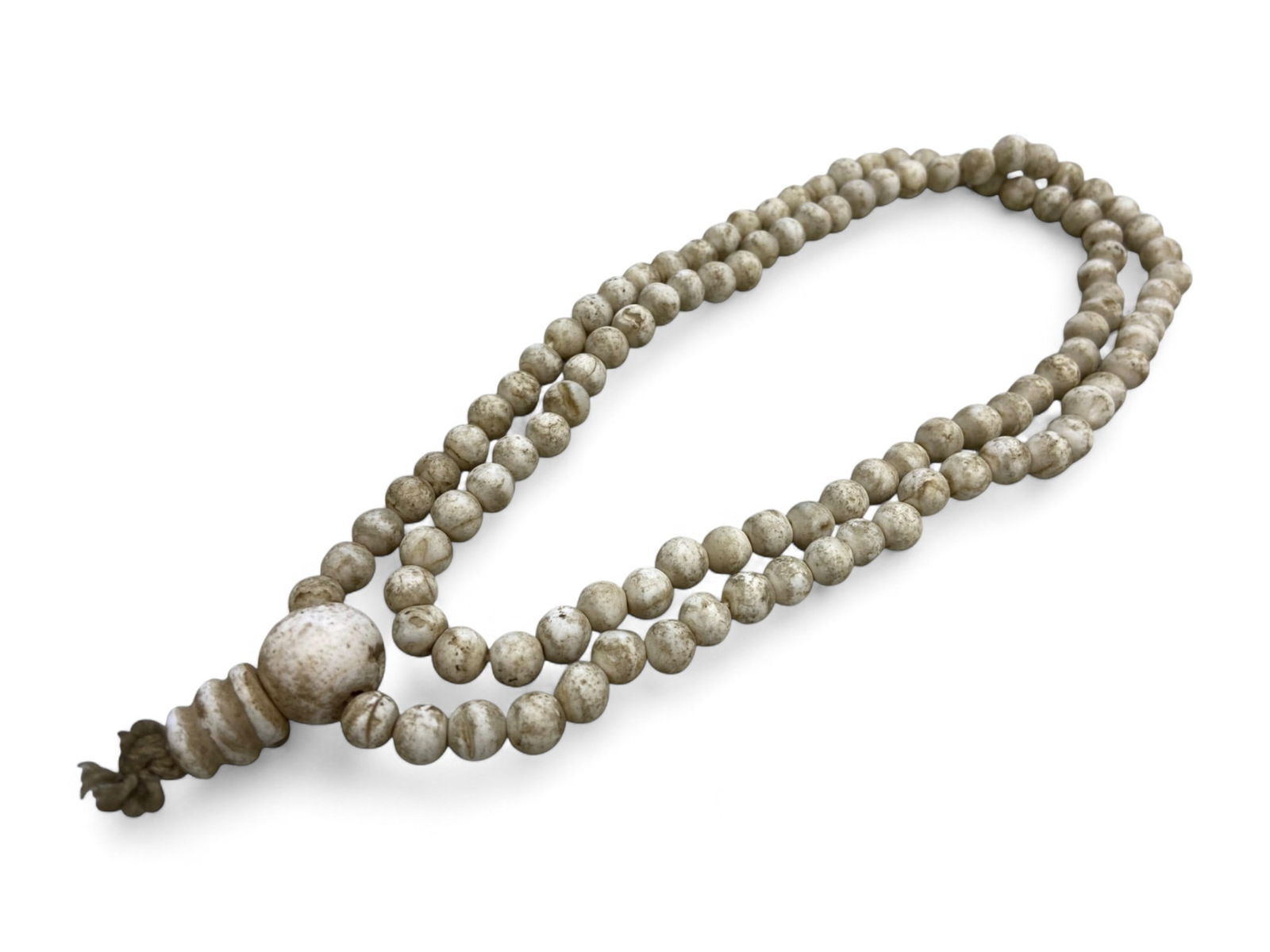 Antique Tibetan Buddhist Mala Prayer Beads Strand, c. Late 19th Century - 102g: This antique Tibetan mala strand is a sacred artifact of spiritual devotion, used by practitioners of Vajrayana Buddhism for generations. Composed of 108 natural-toned round beads with a central guru
