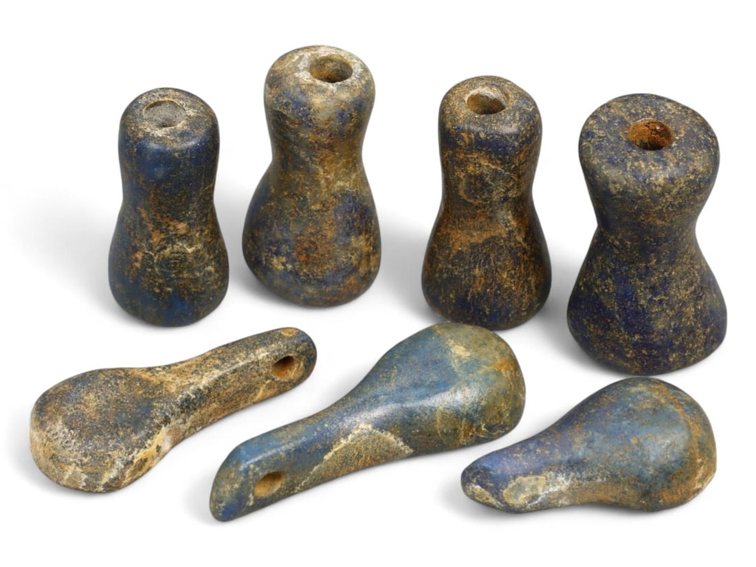 Ancient Bactrian Lapis Lazuli Spoon and Spindle-Shaped Beads Set, c. 3rd-2nd Millennium BCE, 10.2g: This refined group of ancient lapis lazuli beads, dating to the Bactrian era (circa 3rd-2nd millennium BCE), showcases rare forms including both "spoon" and "spindle" silhouettes. Originating from the