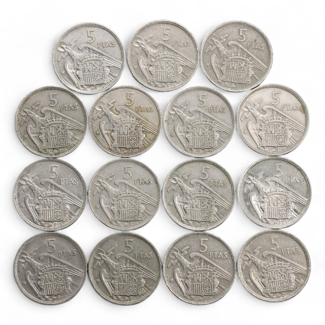 SPAIN: Francoist State - Nationalist Symbolism 5 Pesetas Coin Lot, ca. 1957-1975, 23mm, 85g: This 15-piece group of Spanish 5 Pesetas coins presents a bold visual statement from the final decades of Francisco Franco's regime, where numismatics doubled as national propaganda. Each coin bears t