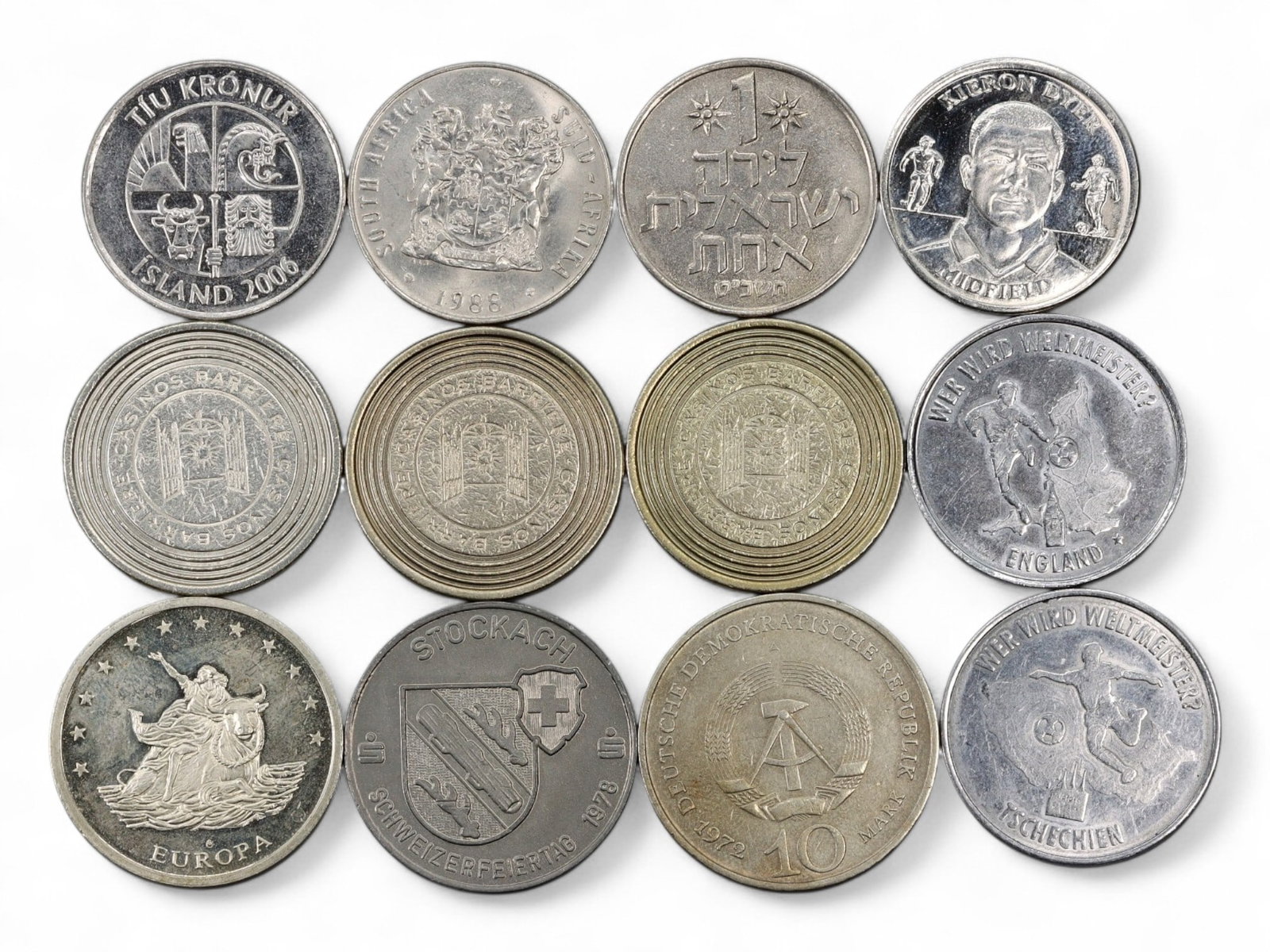 EUROPE National Identity and Sport Coin & Medallic Issue Lot, ca. 1968-2006, 27-31mm, 113g: A spirited group of 12 mid-sized coins and medallic issues exploring the intersection of national iconography, currency reform, and football as a vehicle for continental unity and pride. The ensemble 