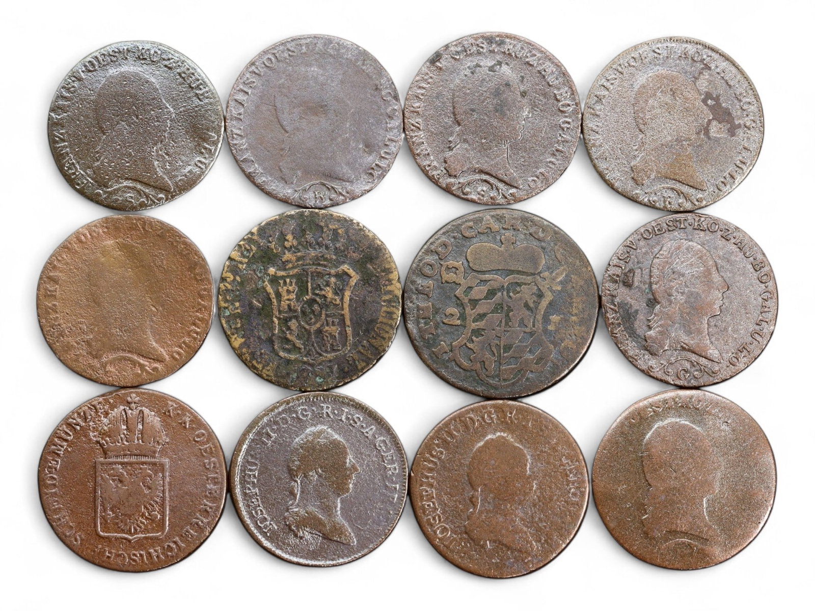 GERMAN STATES/AUSTRIA: Napoleonic Confederation - Southern States Kreuzer Coins, 1812-1830, 62g: Issued amid the backdrop of Napoleonic restructuring and regional autonomy, this assemblage of 12 copper kreuzer coins reflects the localized resilience of German-speaking territories in the early 19t