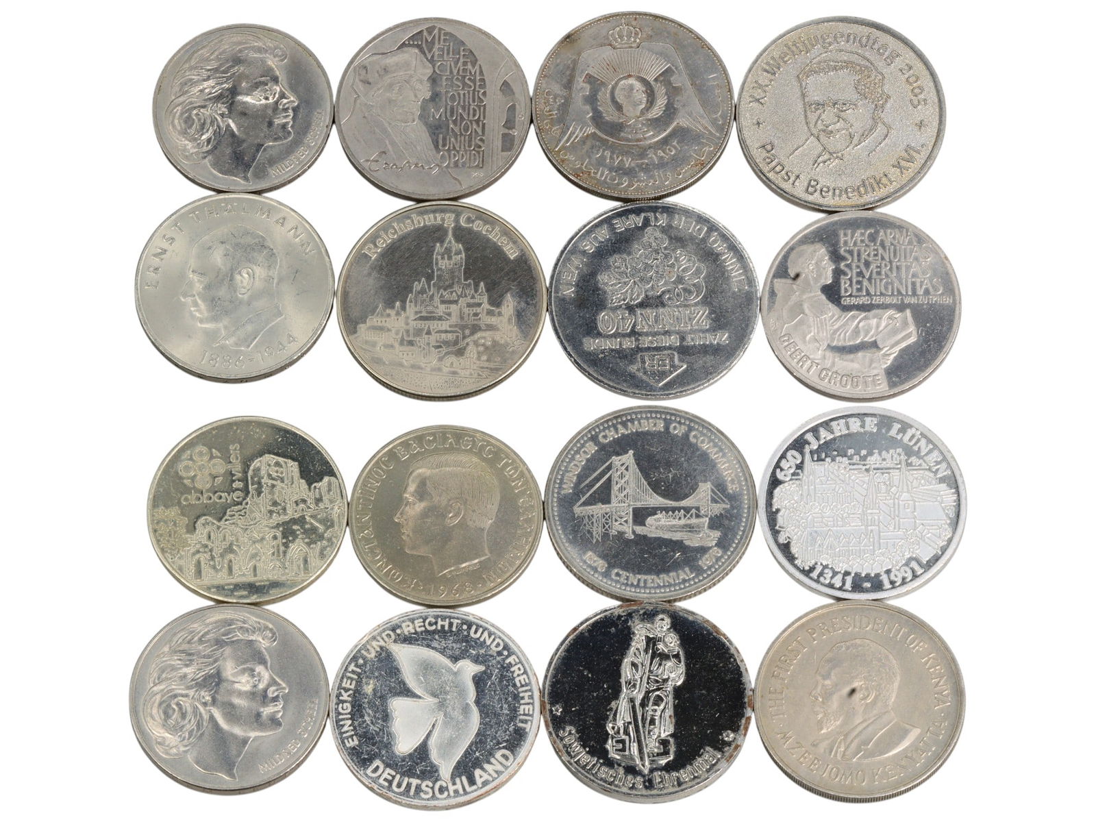 EUROPE/WORLD Unity, Heritage & Ideals Commemorative Token Lot, 20th Century, 16 Pieces, 221g: This 16-piece selection of lightweight aluminum commemorative tokens captures the shifting political, cultural, and economic identity of postwar Europe and beyond. Featuring symbolic motifs such as th