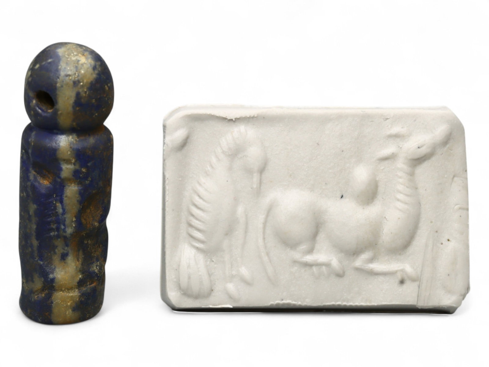 Ancient Akkadian Mythic Beast High-Relief Lapis Lazuli Cylinder Seal, c. 2350-2150 BCE, 6.8g: Carved from regal lapis lazuli and featuring dynamic high-relief imagery, this elongated Akkadian cylinder seal transports us to a world where myth, divinity, and authority were inscribed in stone. Da