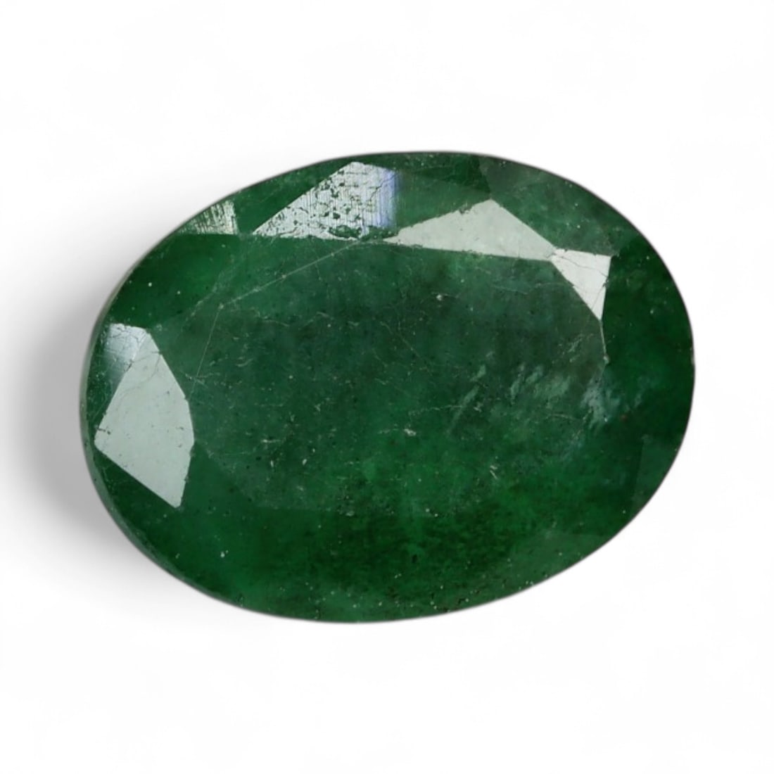 1.32 Carats Deep Green Emerald Oval - Natural Zambian Stone: This richly colored emerald reveals a deep forest green tone with a velvety surface that hints at the gem's unfiltered natural origin. The oval shape is classic and well-proportioned, offering a stron
