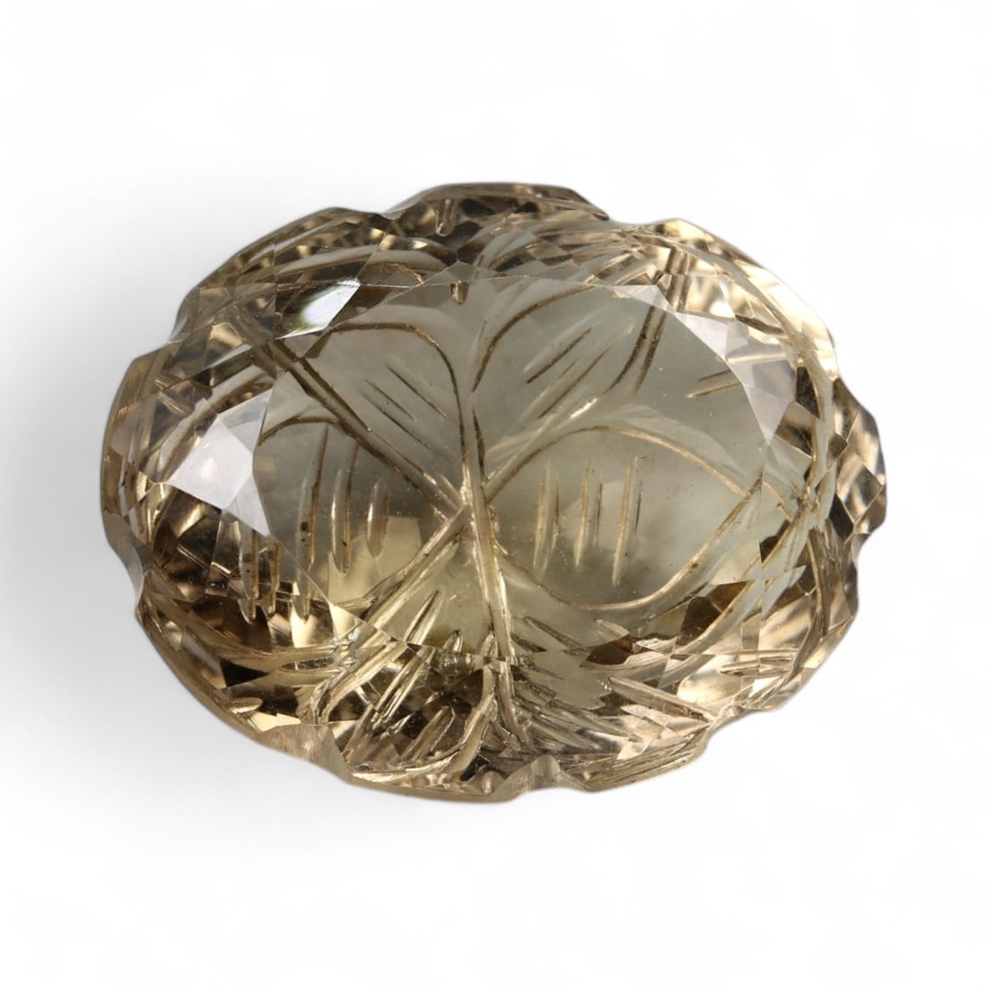 36.40 Carats Golden Champagne Citrine - Natural Brazilian Stone: This commanding citrine is a masterwork of light and form, displaying a warm golden-champagne hue with exceptional internal clarity. Intricately sculpted with radiating lines and layered facet work, t