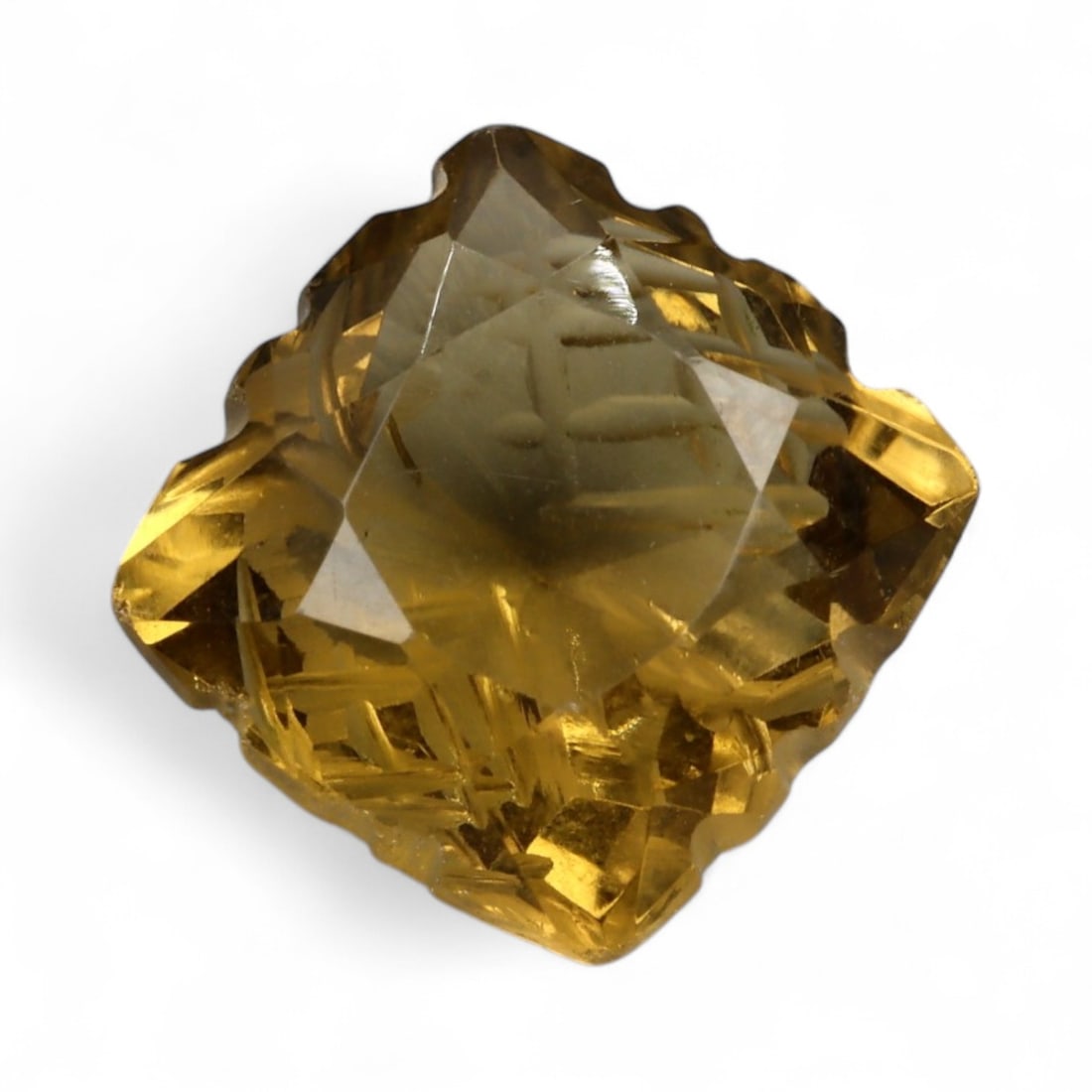 7.25 Carats Golden Champagne Citrine - Natural Brazilian Stone: This commanding citrine is a masterwork of light and form, displaying a warm golden-champagne hue with exceptional internal clarity. Intricately sculpted with radiating lines and layered facet work, t
