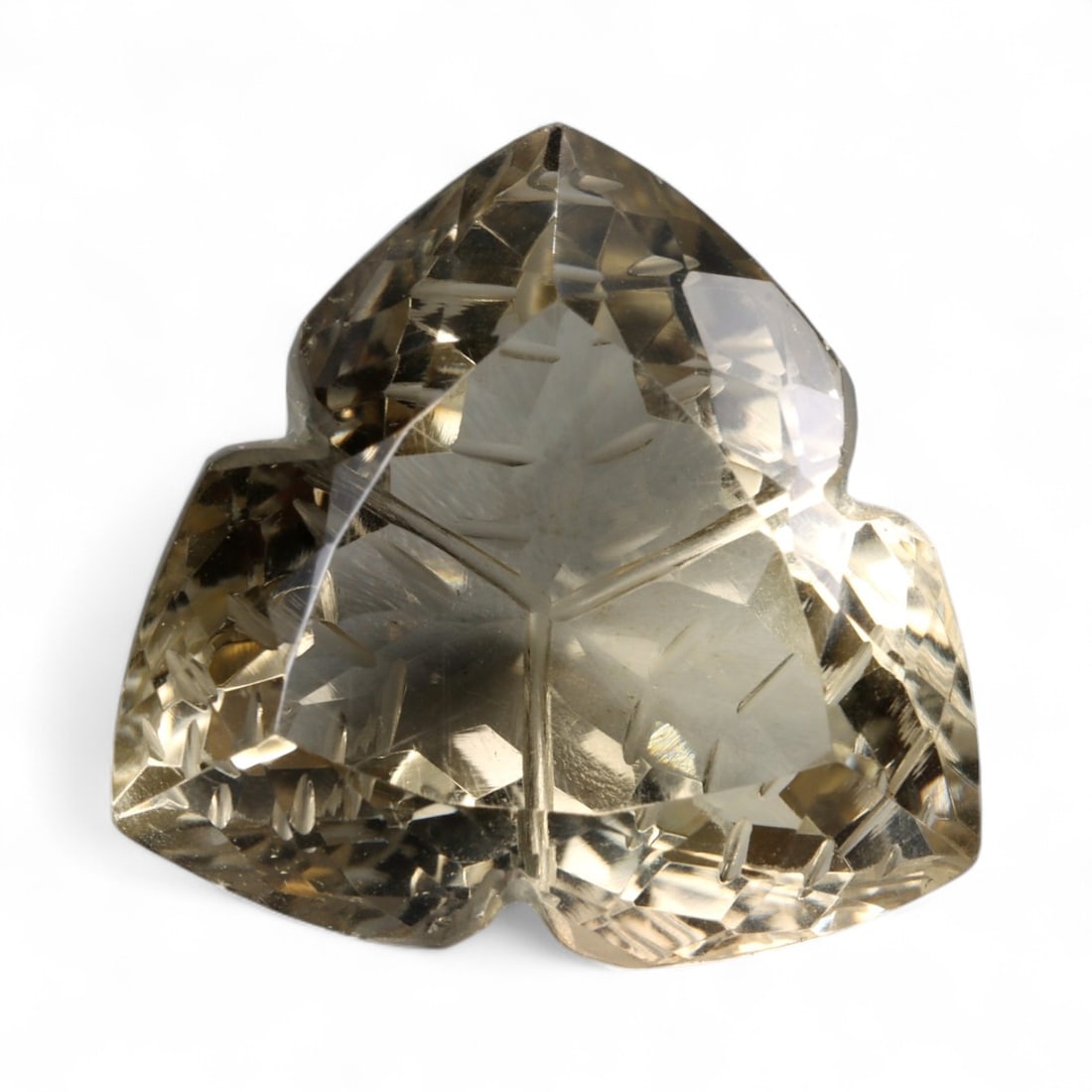 36.15 Carats Golden Champagne Citrine - Natural Brazilian Stone: This commanding citrine is a masterwork of light and form, displaying a warm golden-champagne hue with exceptional internal clarity. Intricately sculpted with radiating lines and layered facet work, t