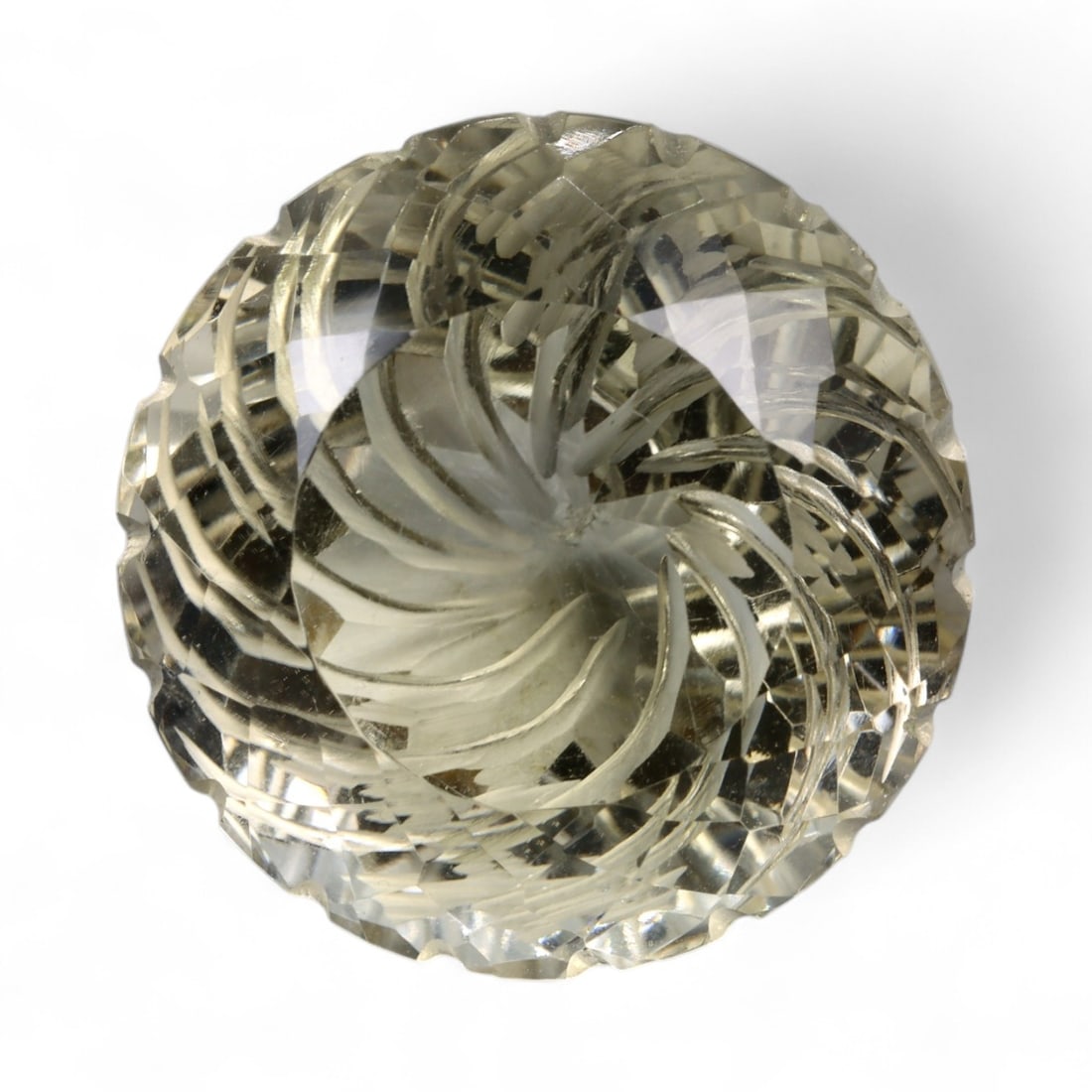 58.15 Carats Golden Champagne Citrine - Natural Brazilian Stone: This commanding citrine is a masterwork of light and form, displaying a warm golden-champagne hue with exceptional internal clarity. Intricately sculpted with radiating lines and layered facet work, t