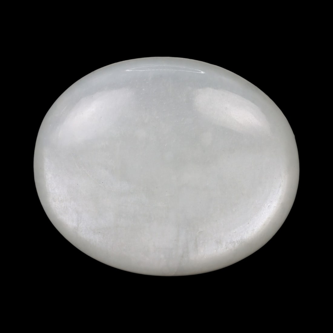 50.29 Carats Silken White Moonstone - Natural Loose Gemstone: This substantial white moonstone exudes a gentle, luminous glow, with a silken body tone that captures soft reflections across its polished surface. Its milky translucence offers a calm, understated e
