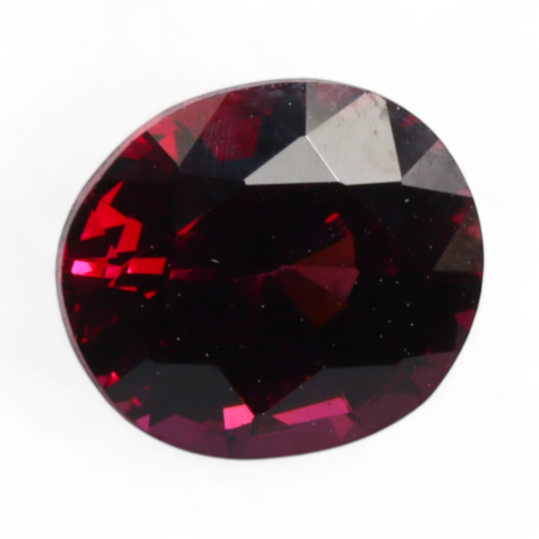 2.06 Carats Rich Raspberry Mahenge Garnet - Natural Tanzanian Stone: This vivid Mahenge garnet gleams with a lush raspberry red tone, animated by vibrant flashes of fuchsia and wine-like undertones. Its saturation is intense without overpowering, revealing a lively bri