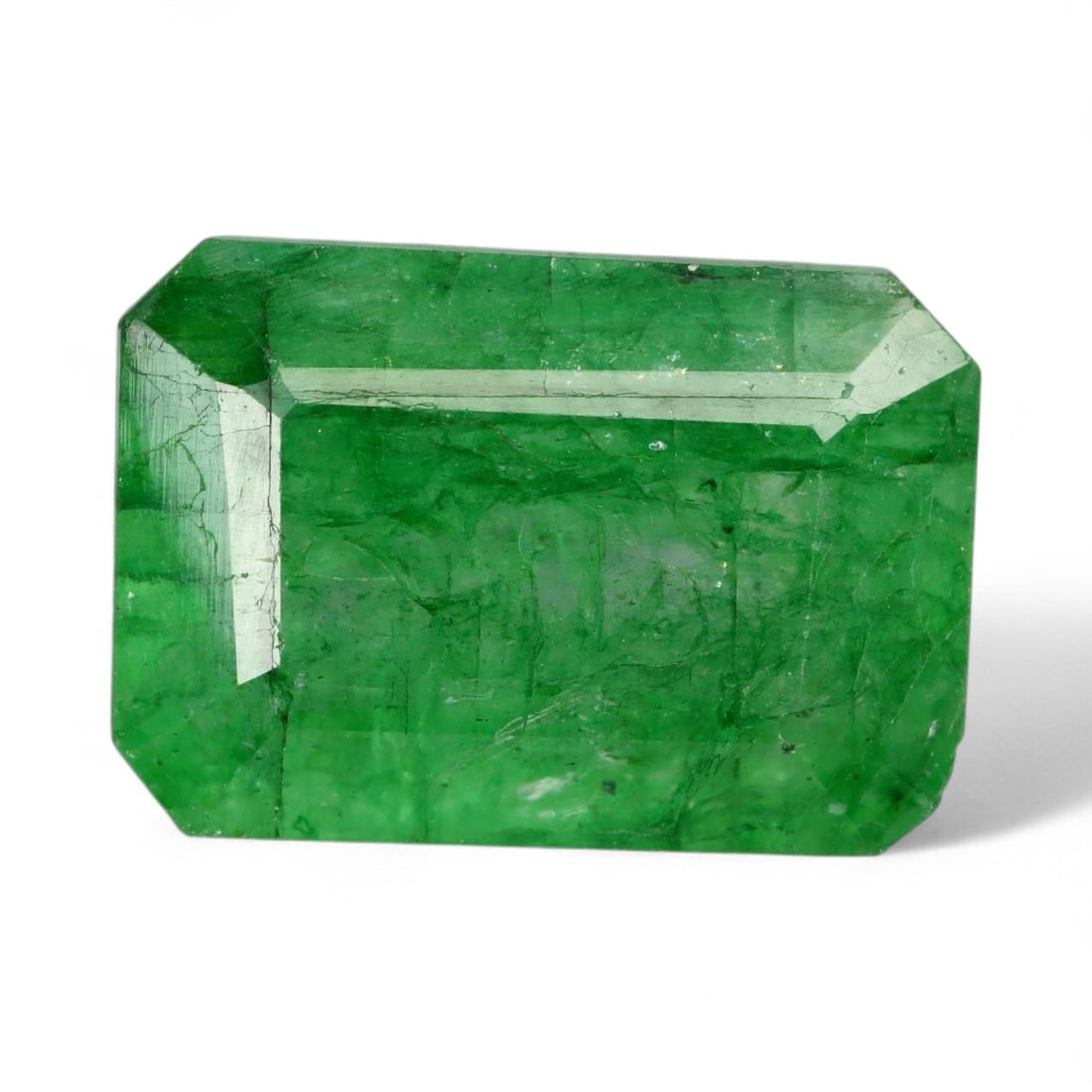10.44 Carats Vivid Green Beryl - Natural Loose Gemstone: This vibrant green beryl exhibits a lush, saturated color reminiscent of spring foliage, with a lively translucence that glows from within. Its faceted surface enhances the stone's natural brilliance,