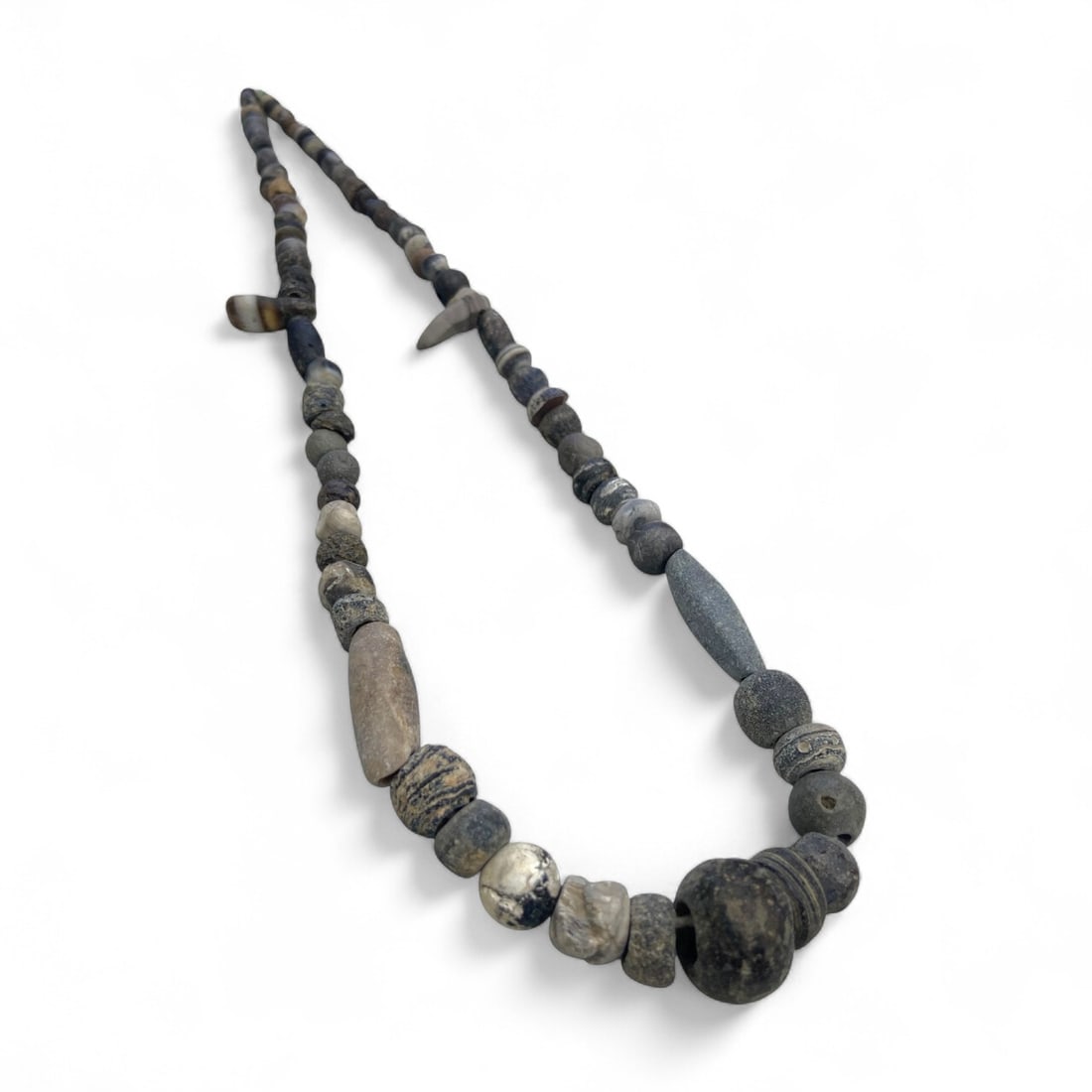 Ancient Parthian Hardstone Bead Strand Collection, c. 2nd Century BCE - 2nd Century CE, 36g: This evocative strand of ancient beads, attributed to the Parthian Empire, offers a subdued yet powerful glimpse into the material culture of one of the ancient world's great eastern empires. Composed